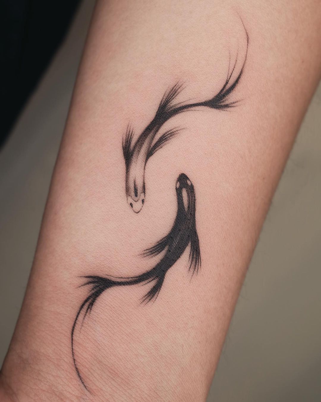 Two fish tattoo design by tattooist arirang
