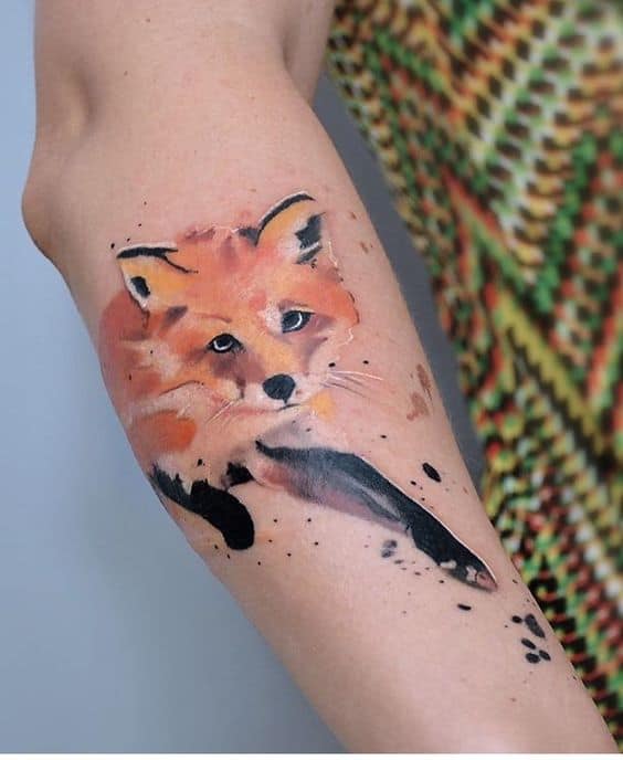Watercolor fox tattoo on arm