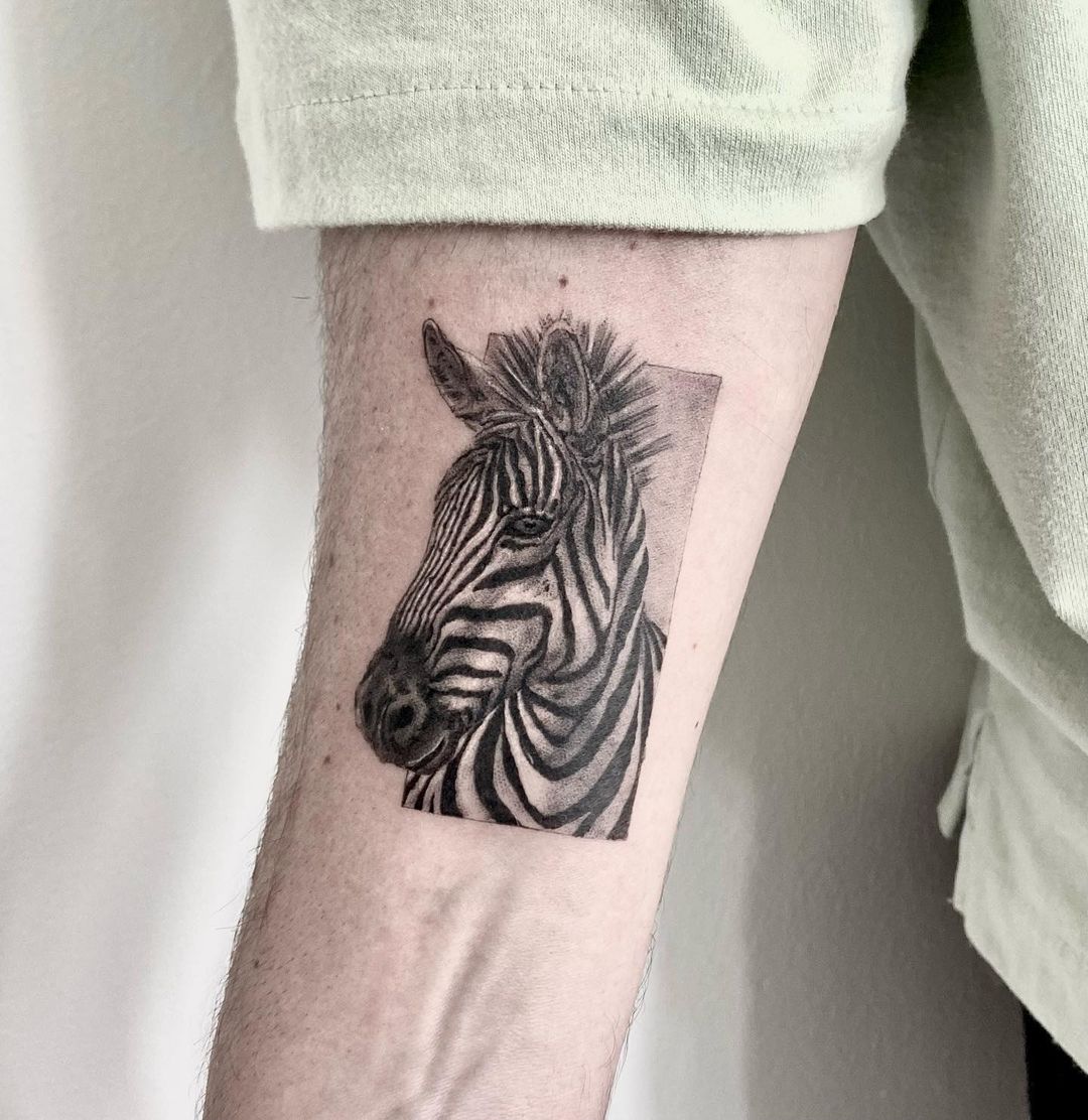 Unique And Eye-catching: Express Yourself With A Zebra Tattoo