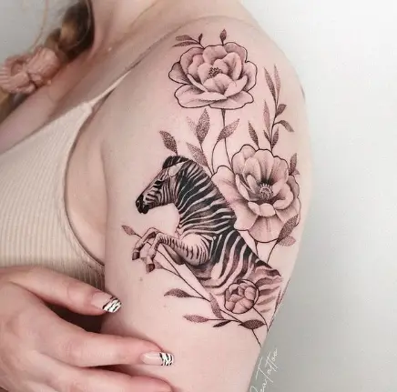 Zebra with flower tattoo by szatattoo