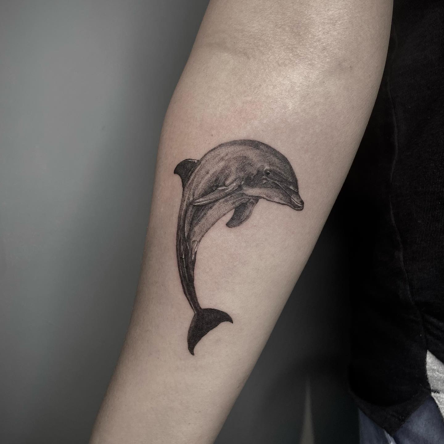 Black and gray dolphin tattoo by lockey ink
