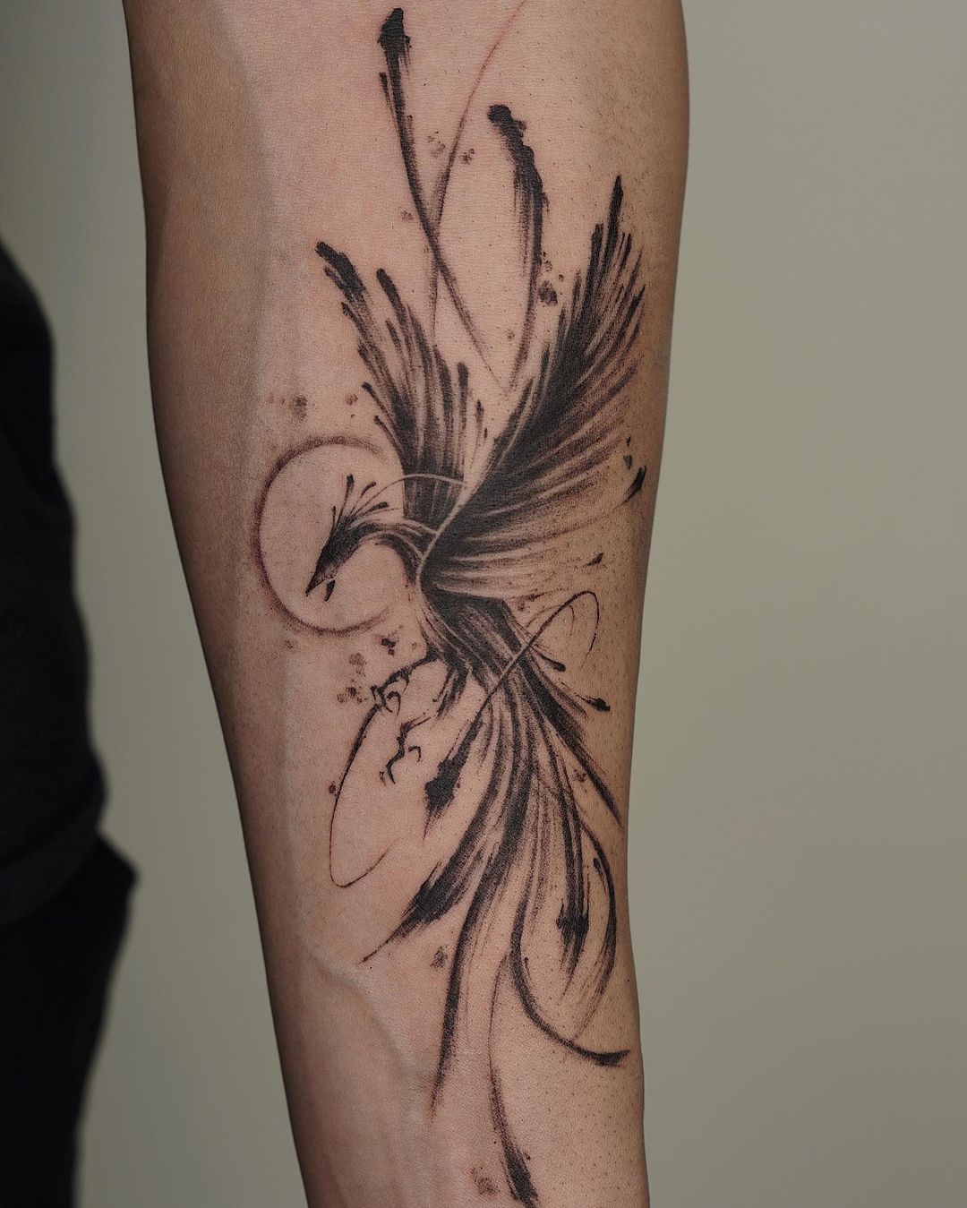 Black phoenix tattoo by woog tattoo