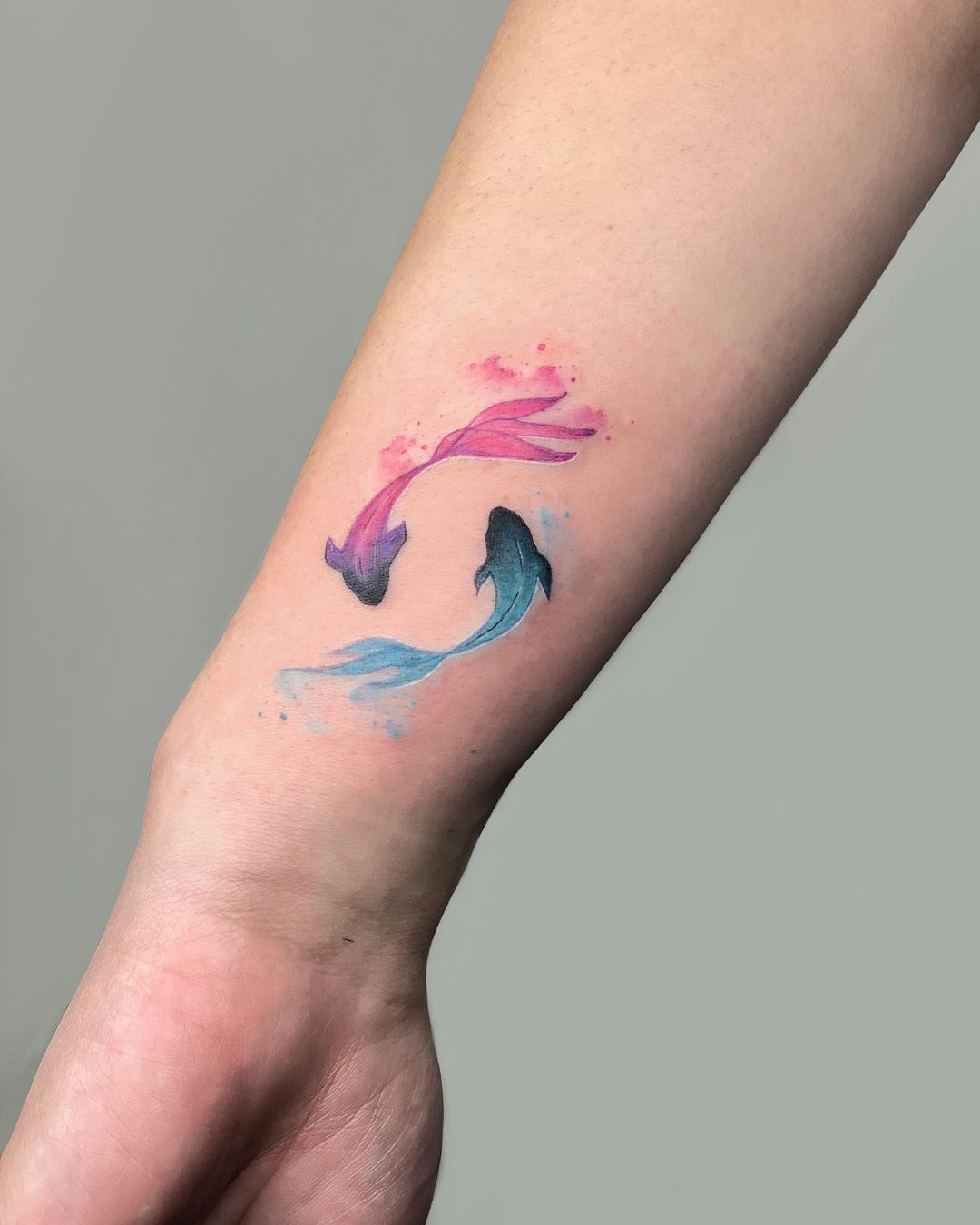 Colorful fish tattoo by hossoms.tattoos