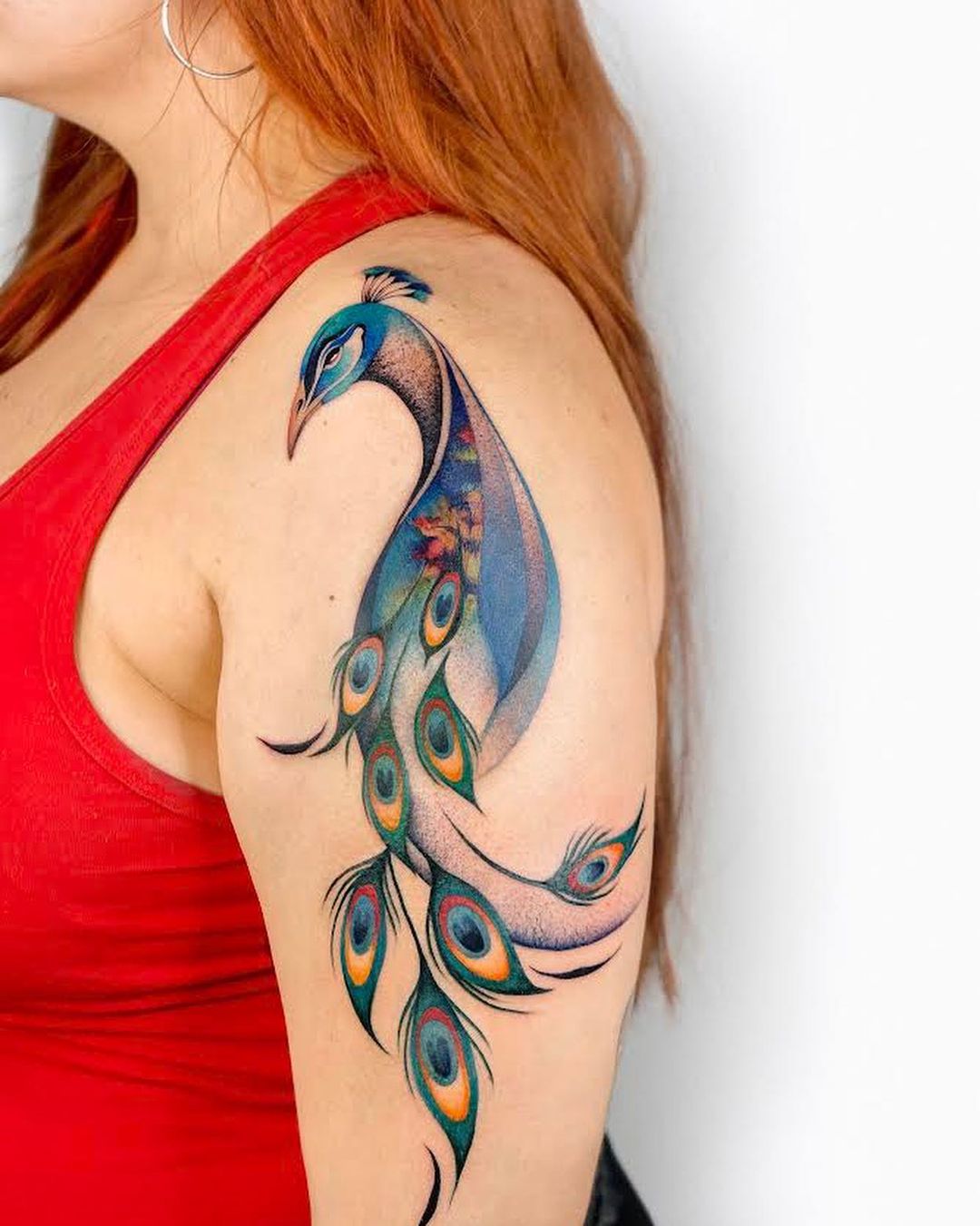 Colorful peacock tattoo by undrgrnd.sf