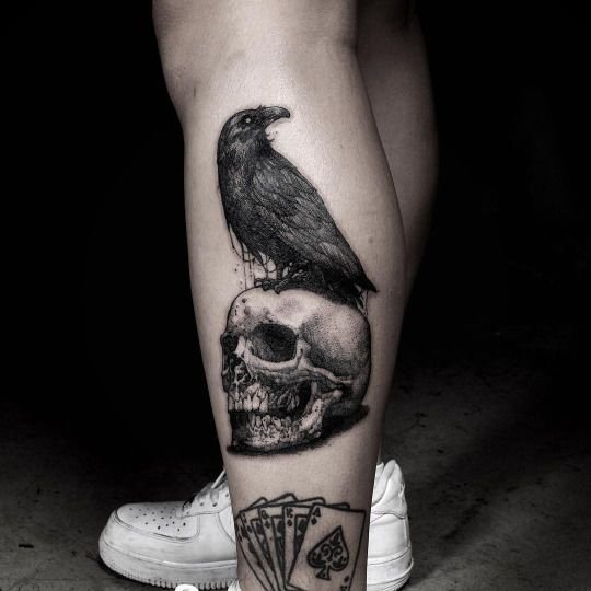 Crow tattoo on leg 3