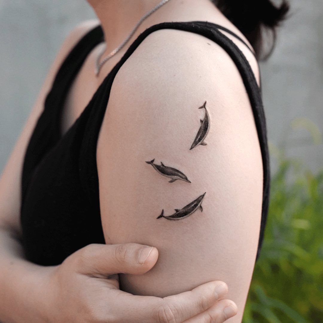 Dolphin tattoo for women by tattooist kimria