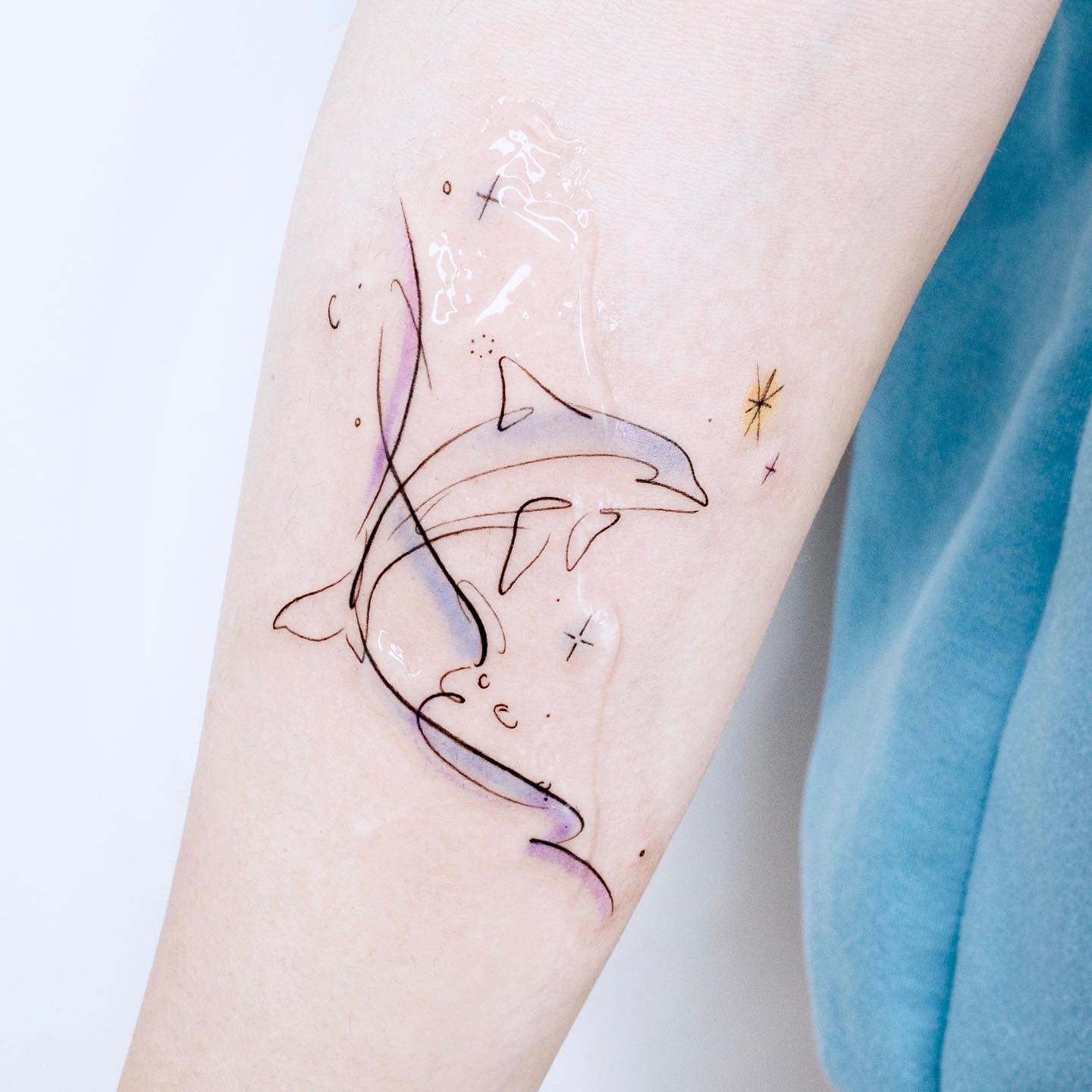 Dolphin tattoo on forearm by heim tattoo