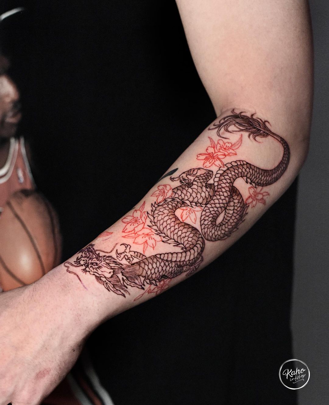 Dragon tattoo on arm by kahoinkshop