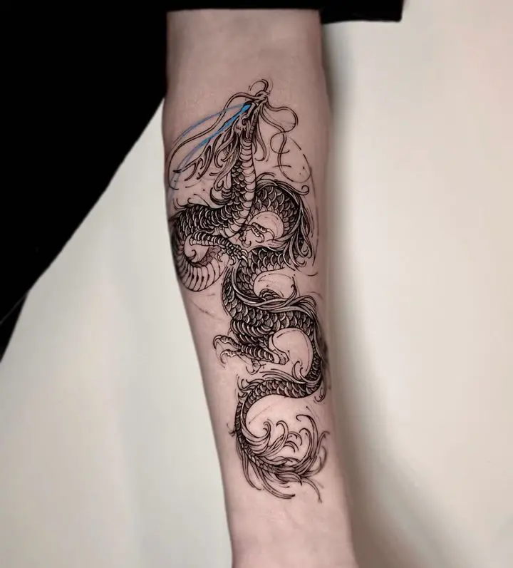 Dragon tattoo on arm by tadi tattoo