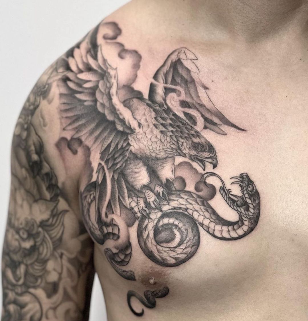Eagle with sanke tattoo by inkvision