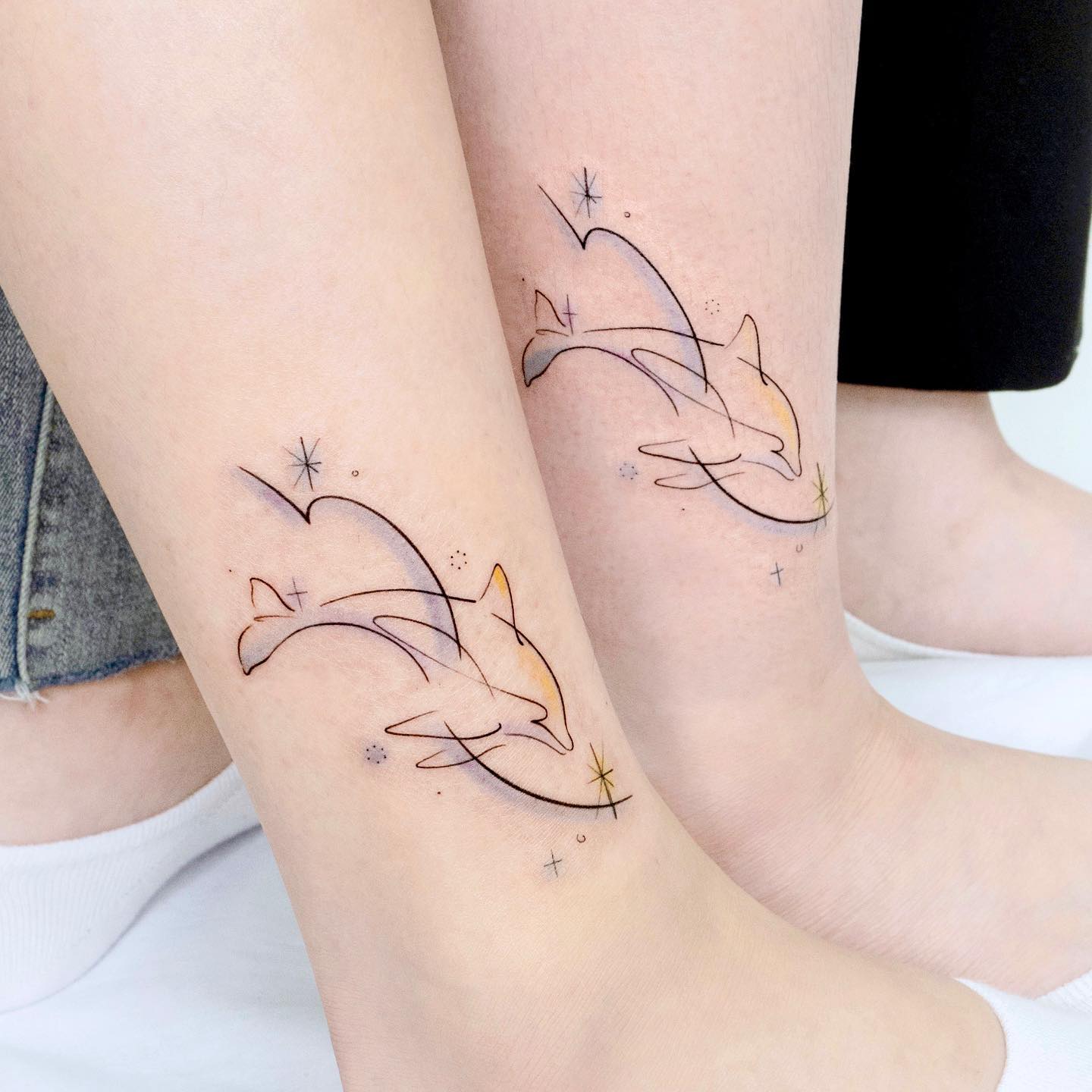 Fineline dolphin tattoo by heim tattoo