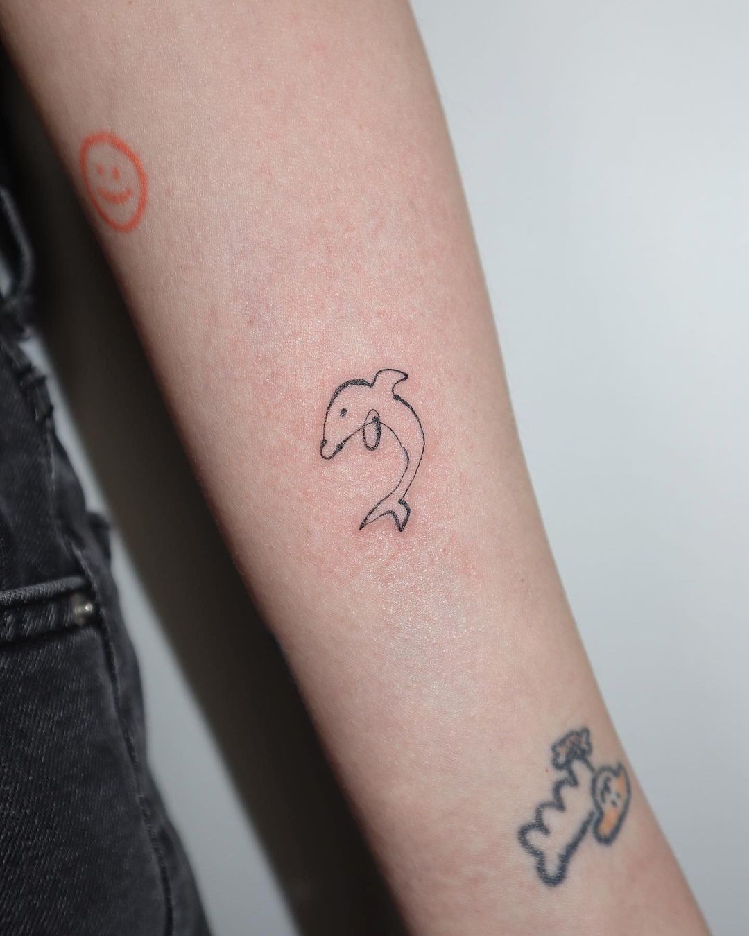 Fineline dolphin tattoo by joodletattoo