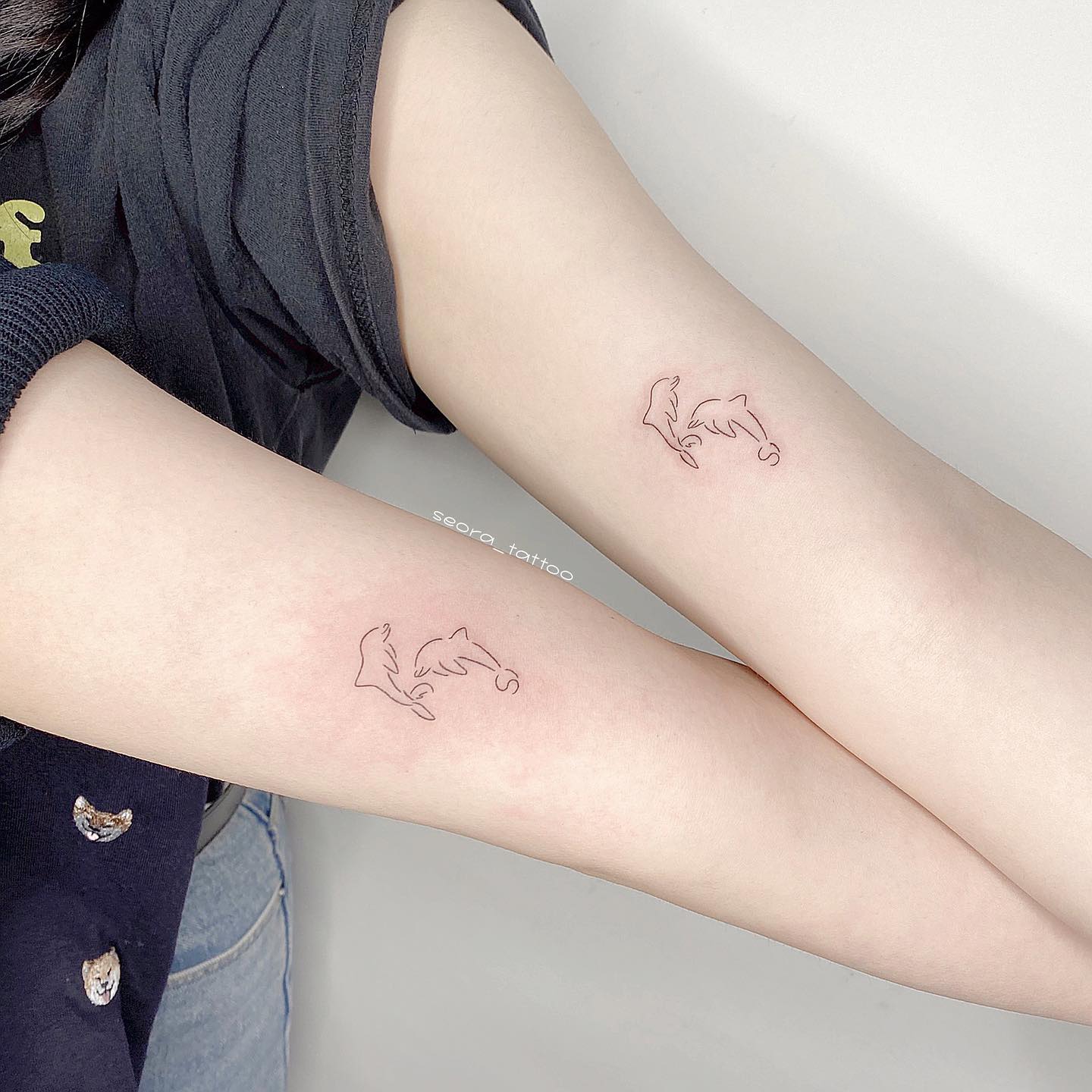 Fineline dolphin tattoo by seora tattoo