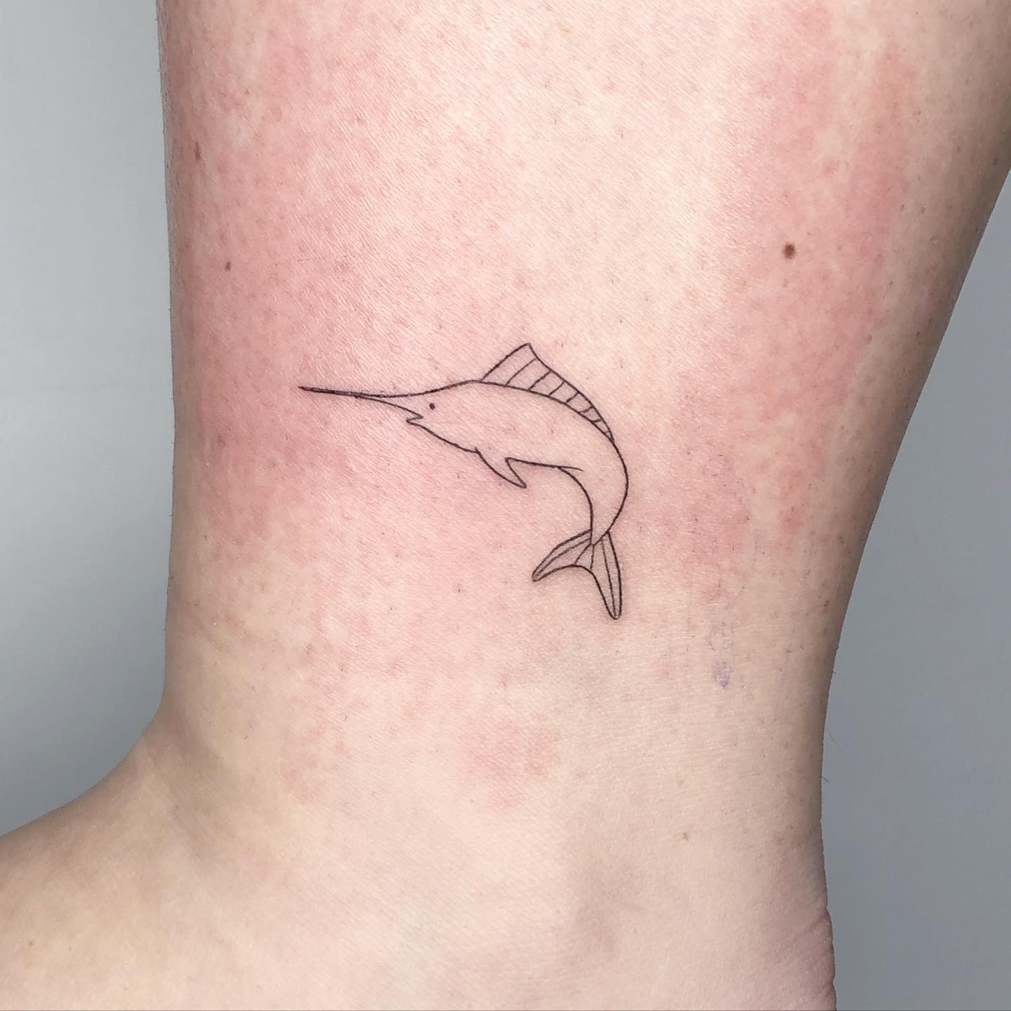 Fineline swordfish tattoo by pauletteceyrat
