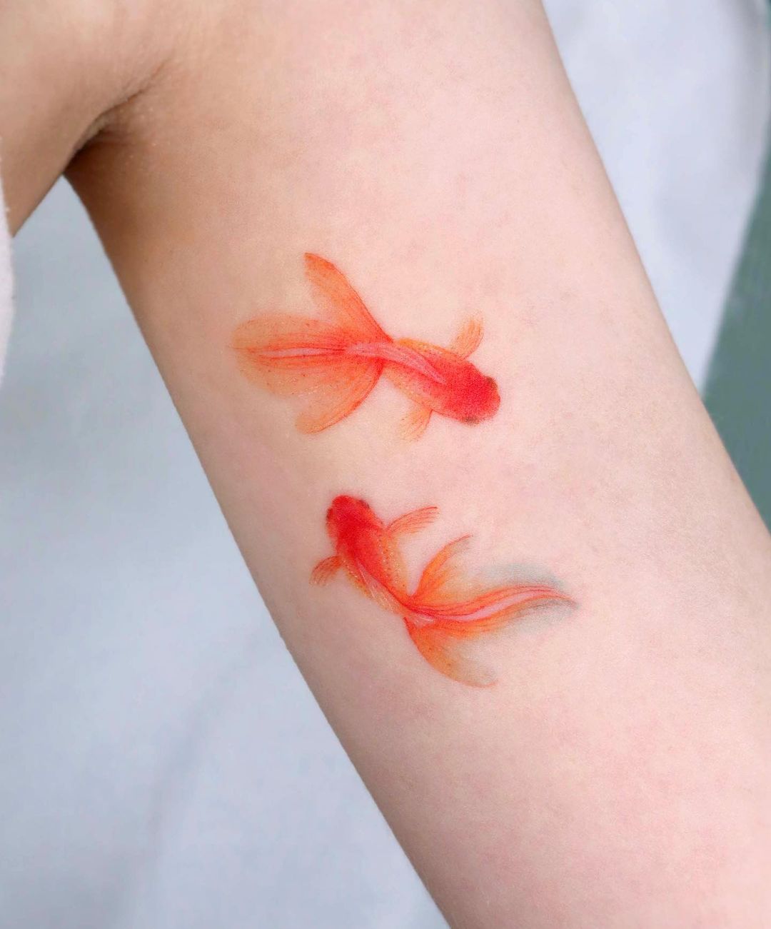 Gold fish tattoo by eunyutattoo