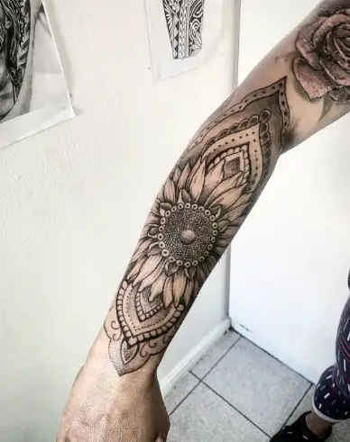 Mandala sunflower tattoo by charliejerasmus