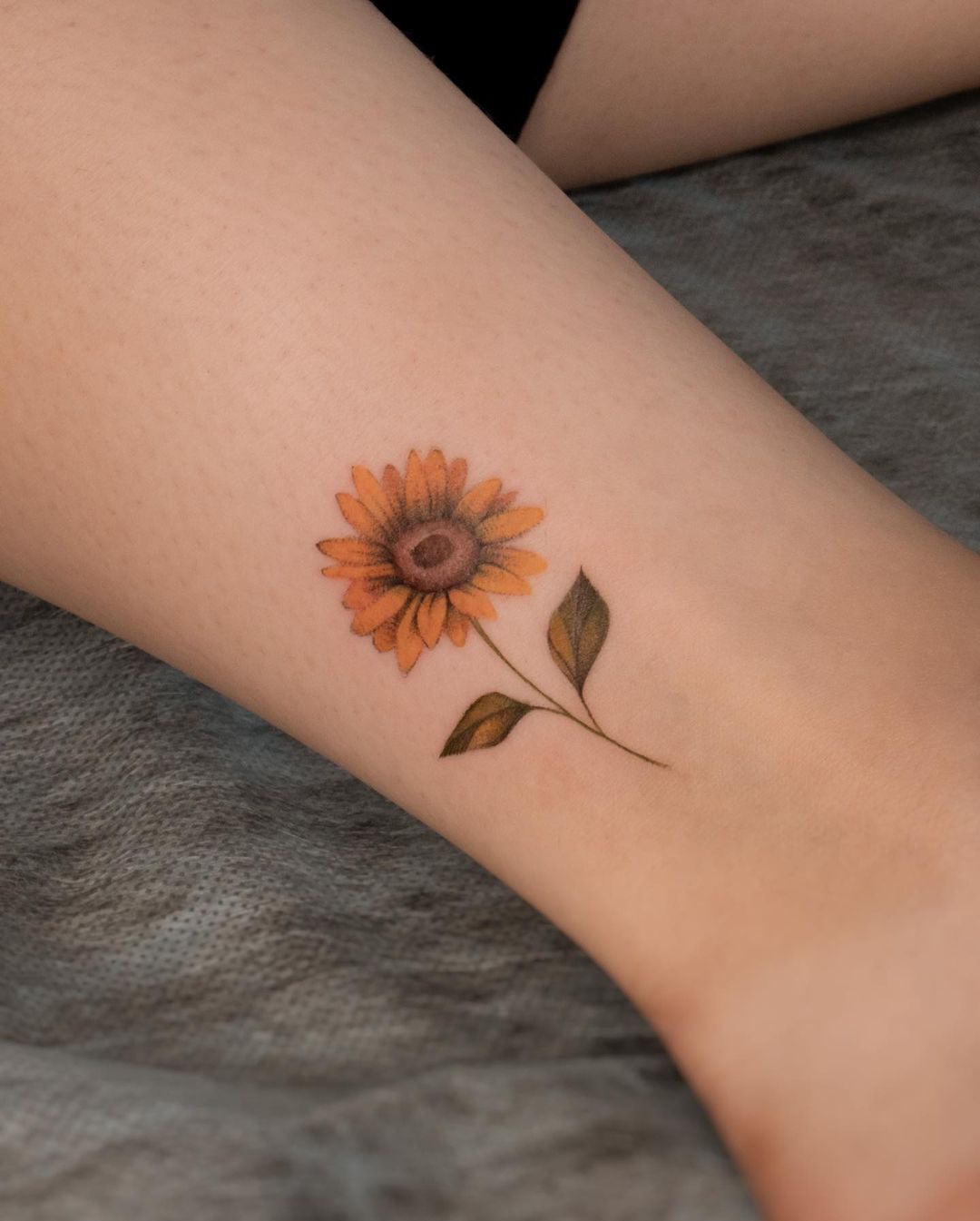 Mini sunflower tattoo by nurai.tattoo