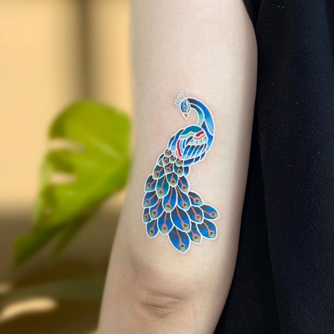 Minimalistic peacock tattoo by minhwa.tattooist