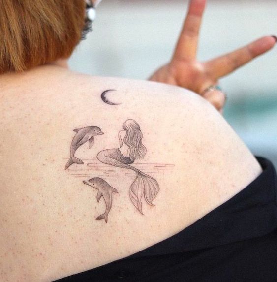 Moon dolphin tattoo 2