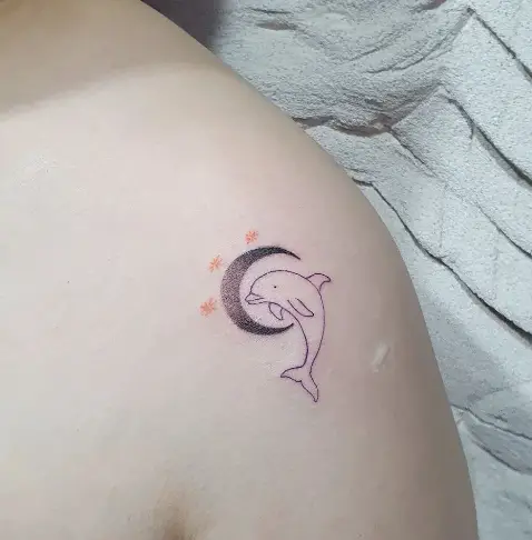Moon dolphin tattoo by ho tattoo