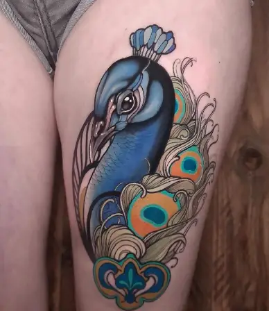 Peacock tattoo on thigh by niktherookie