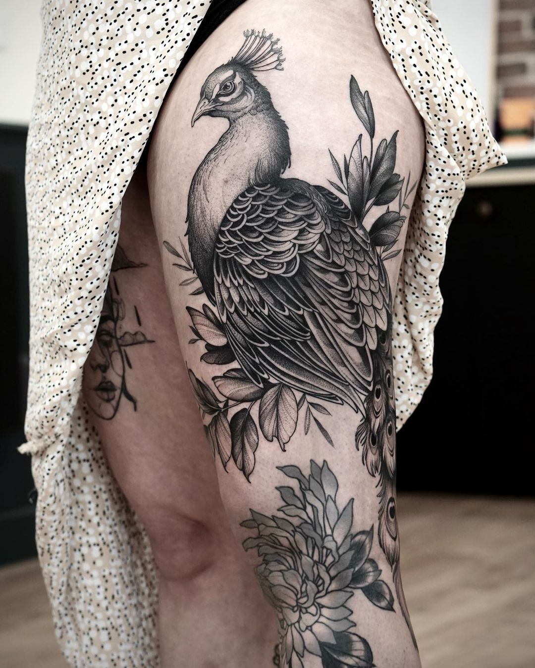 Peacock tattoo on thigh by ornela ttt