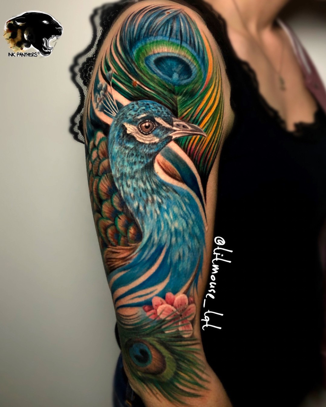 Peacock tattoo on upper arm by inkpanthers
