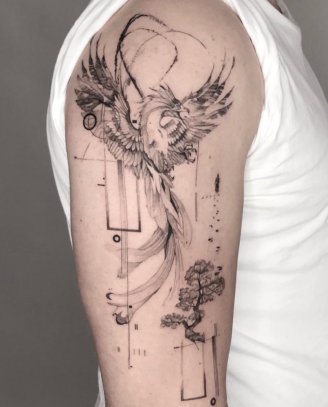 Phoenix tattoo on arm by hood.seven