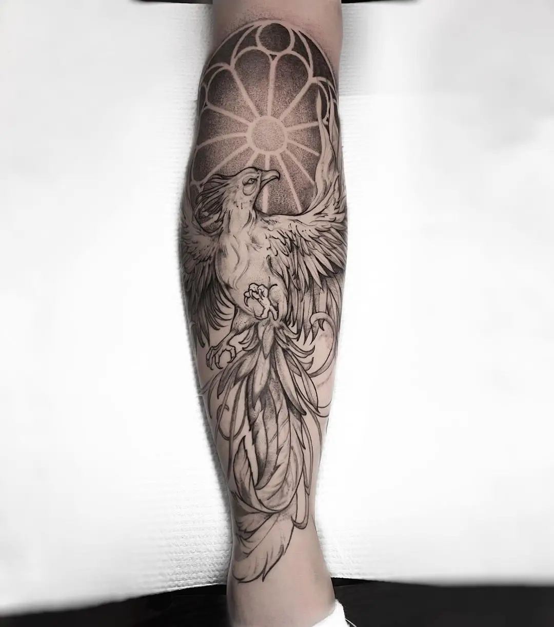 Phoenix tattoo on leg by joe pepper