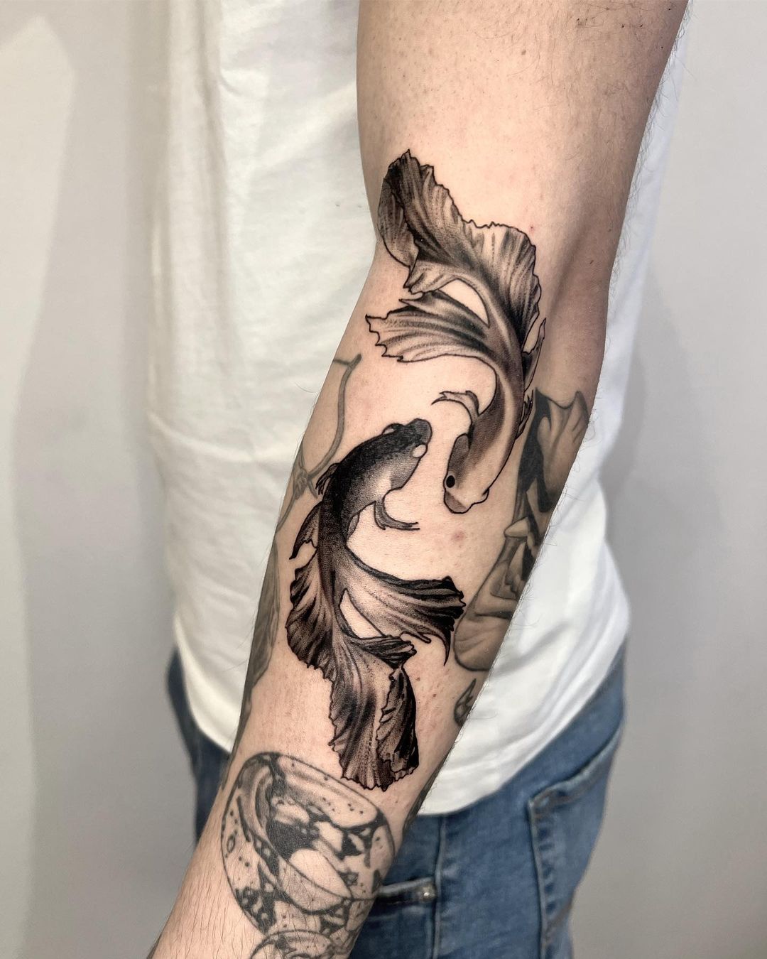 Realistic fish tattoo by miserflow.tattoo