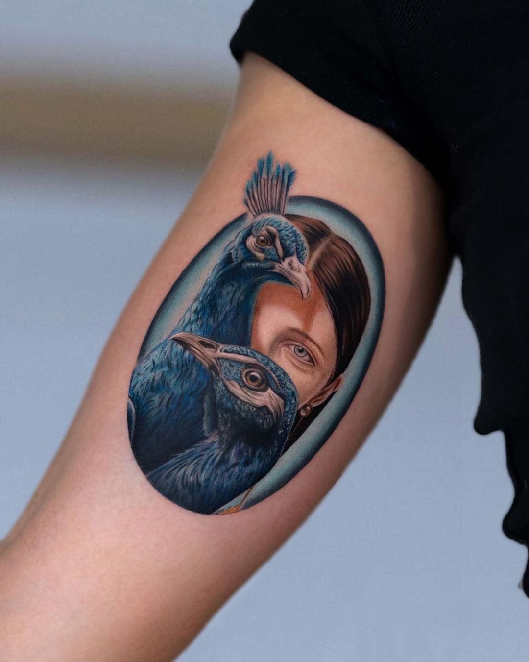 Realistic peacock tattoo design by