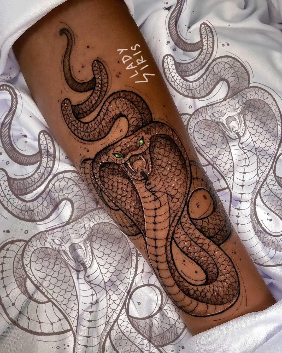Realistic snake tattoo by ladyiristattoo