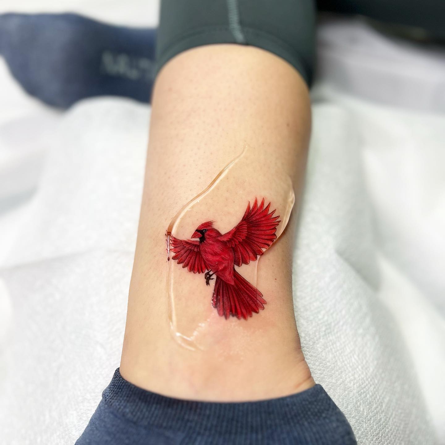Red bird tattoo by jingstattoo