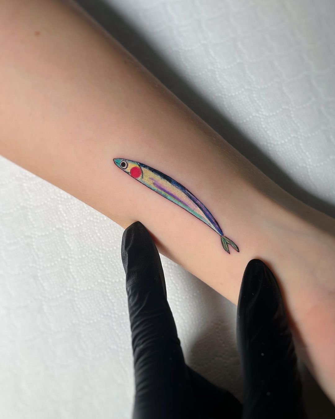 Simple fish tattoo by sonia tessari