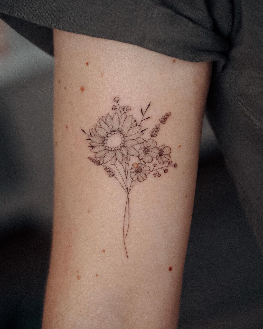 Simple realistic sunflower tattoo by bunami.ink