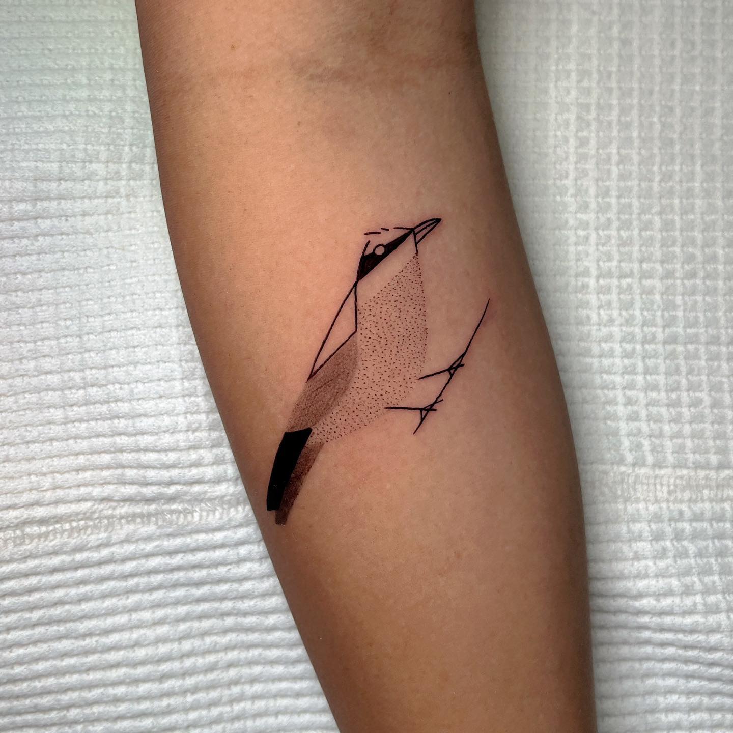 Small bird tattoo by