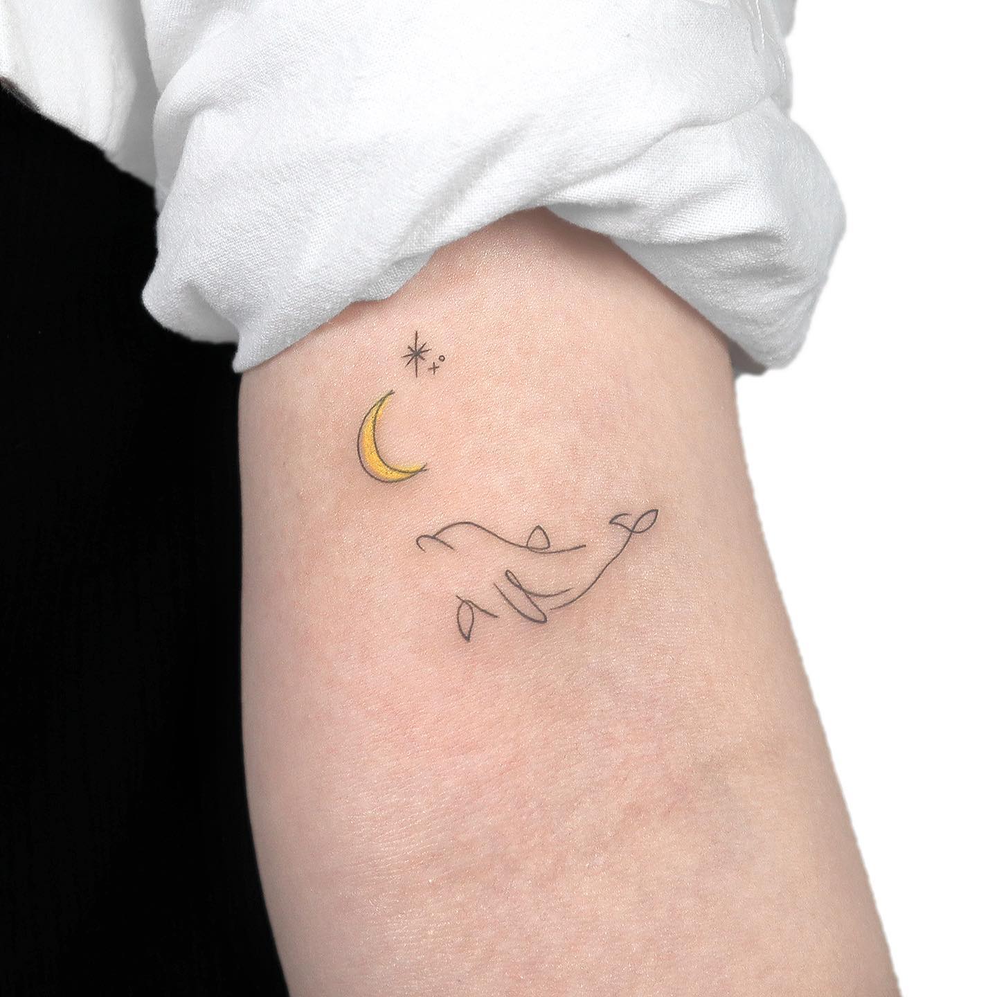 Small dolphin tattoo by gigi tattooer
