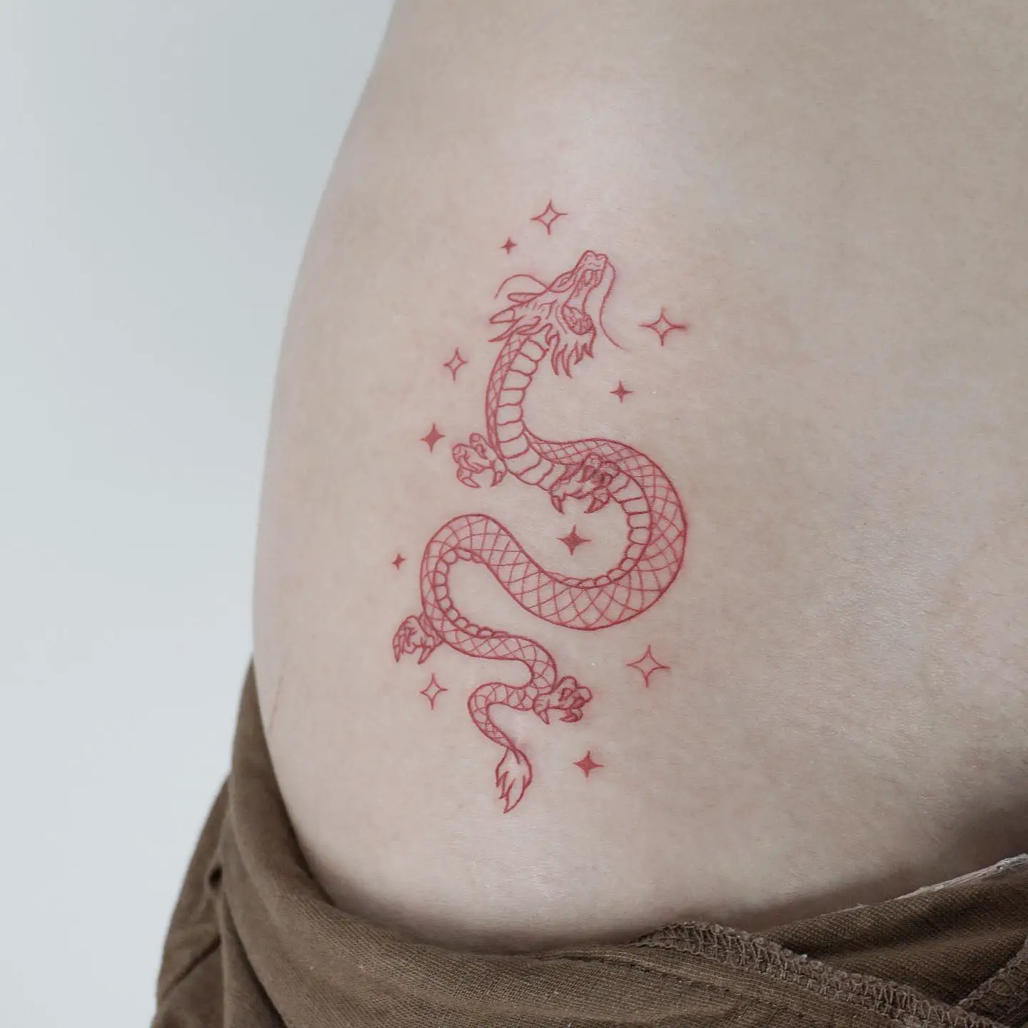 Small dragon tattoo by joeysneedle