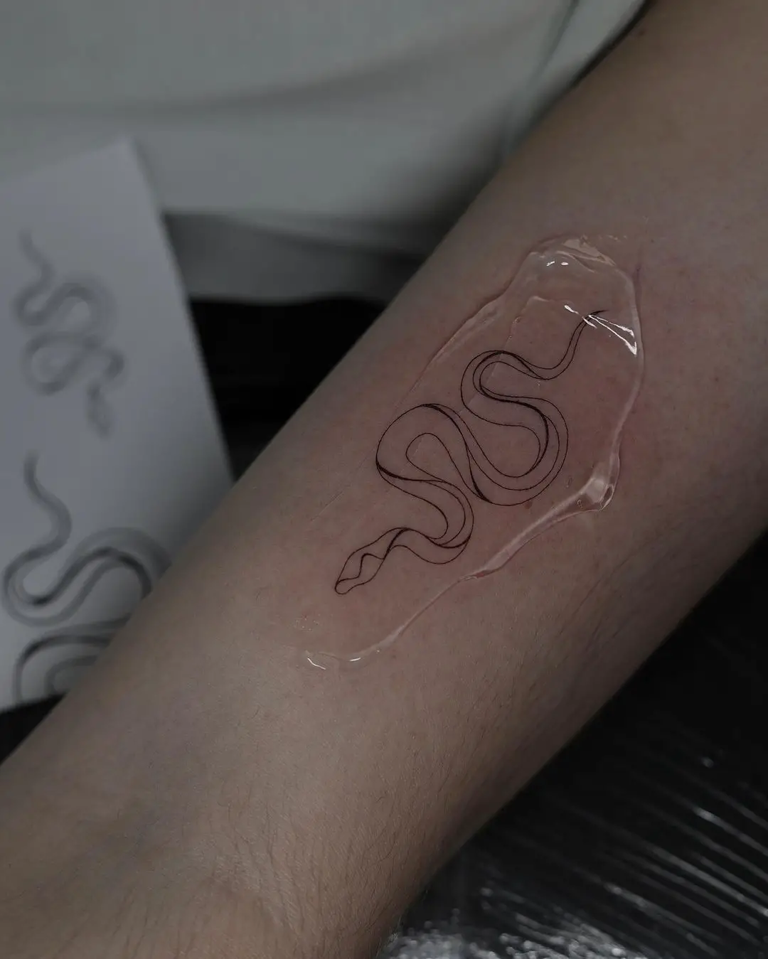 Small snake tattoo by