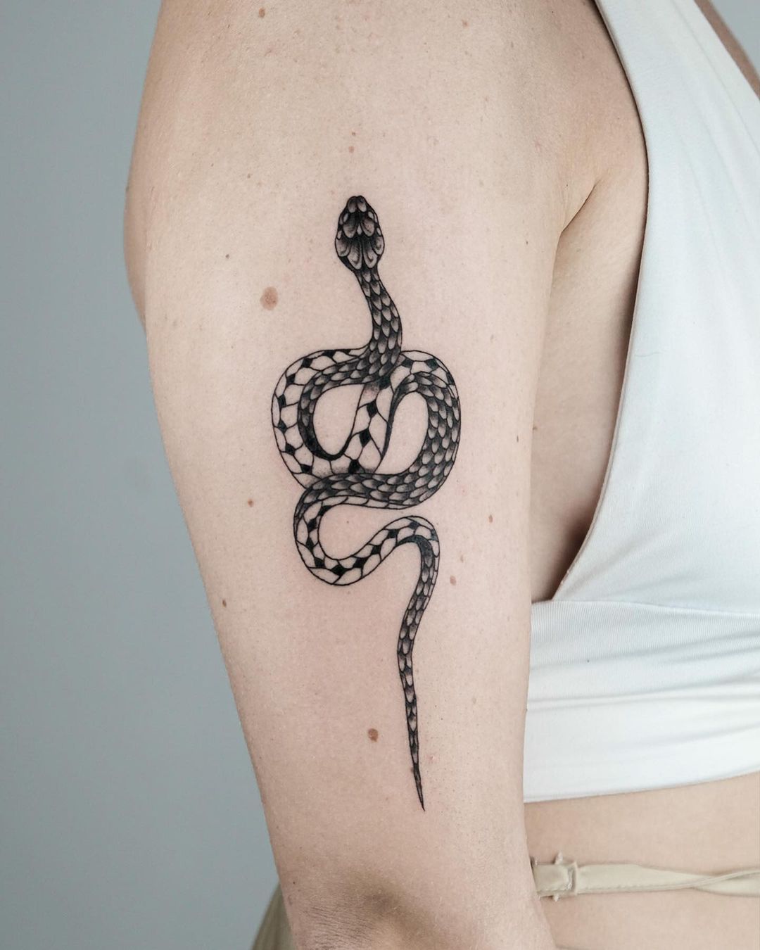 Small snake tattoo by mistermonster