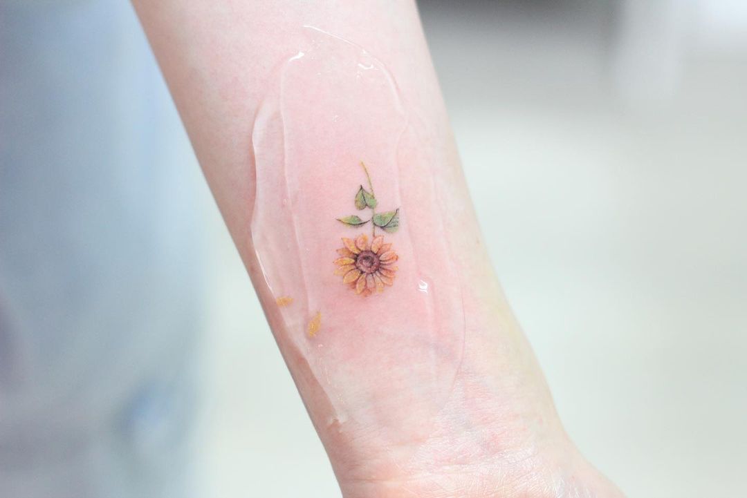 Small sunflower tattoo by ciel tattoo