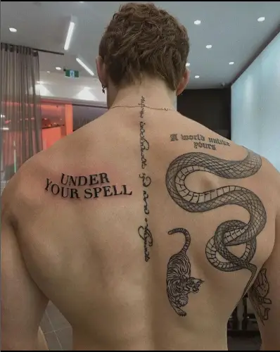 Snake tattoo on back by vrise.viral