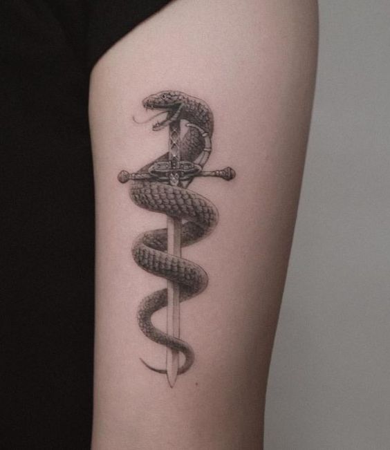 Snake with dagger tattoo 1