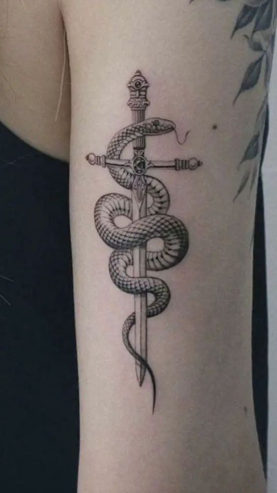 Snake with dagger tattoo 4