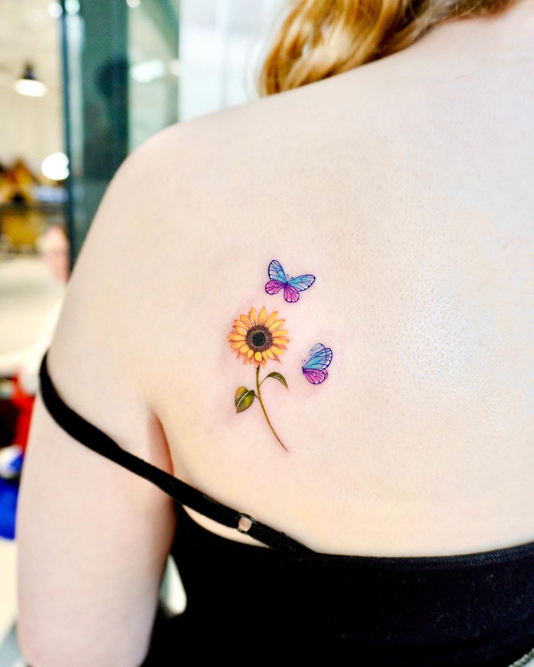 Sunflower with butterfly tattoo by kico.tattoo