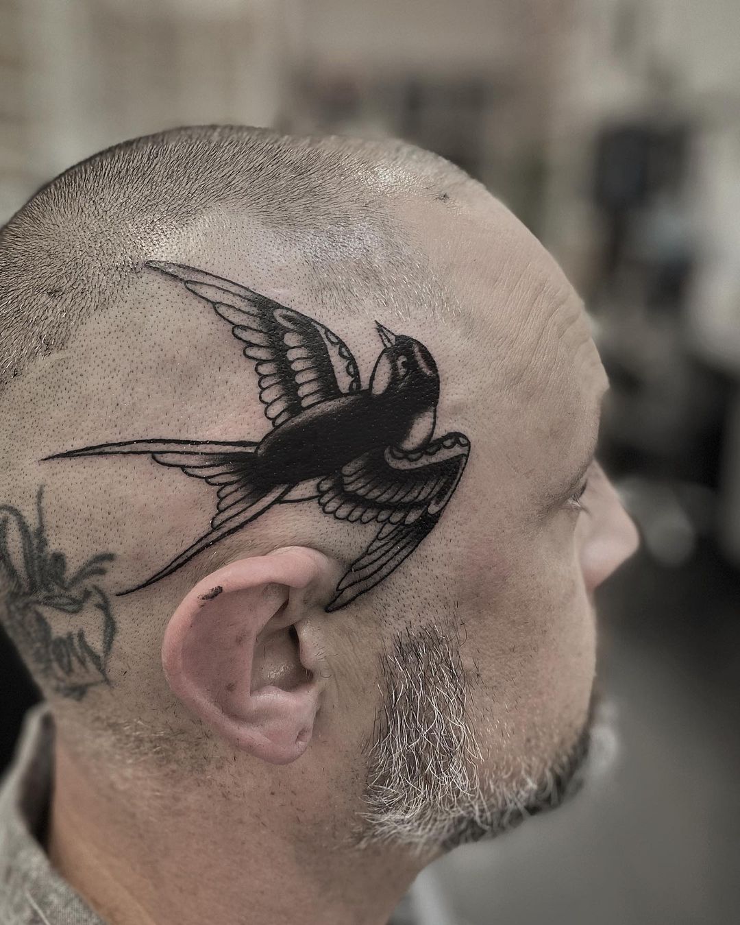Swallow tattoo by nicholasleetattoo
