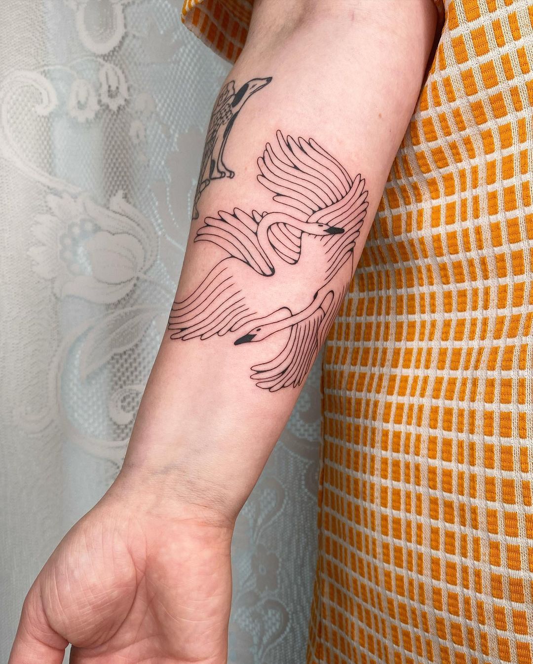 Swan tattoos by comb alone