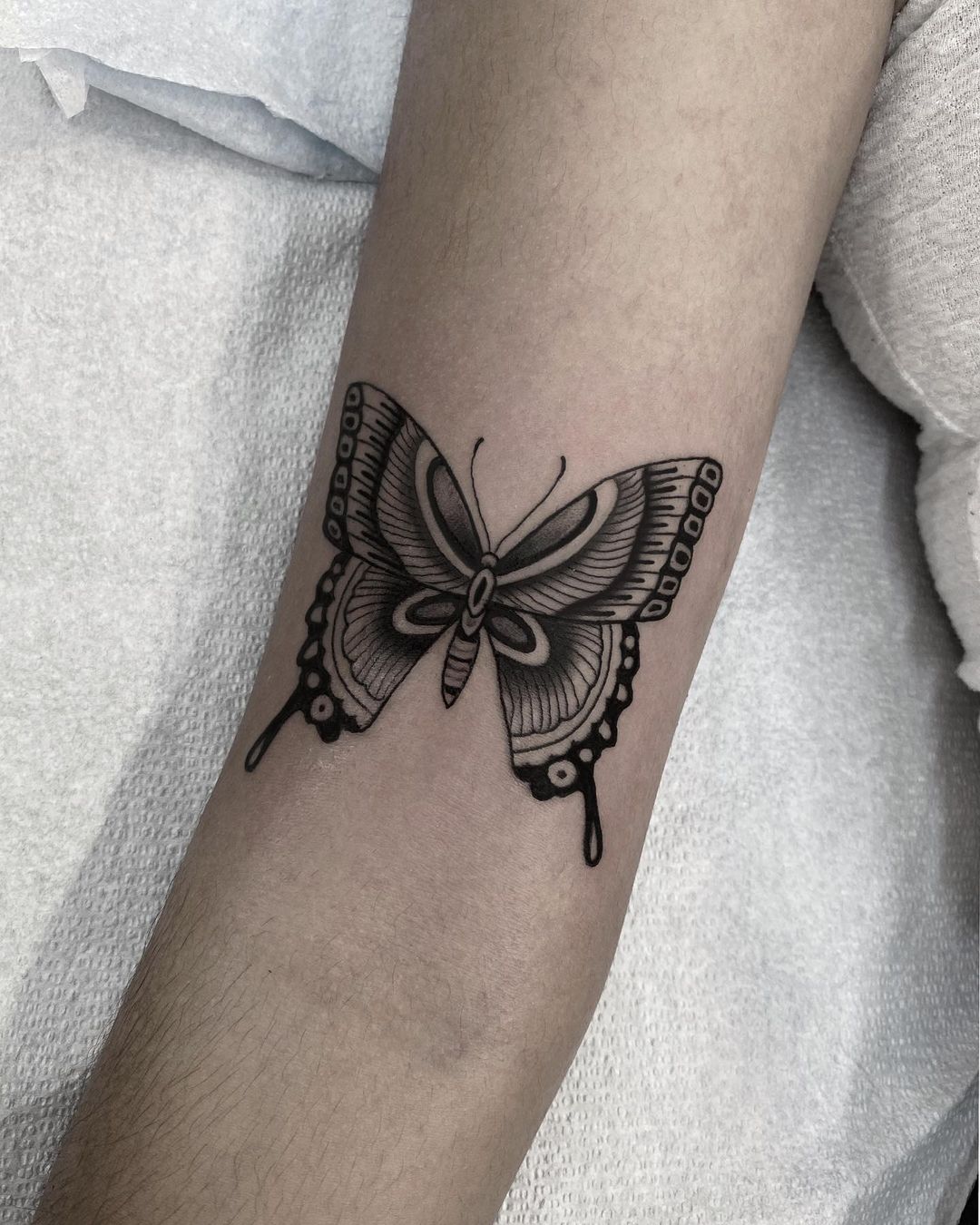 Traditional butterfly tattoo by nicholasleetattoo