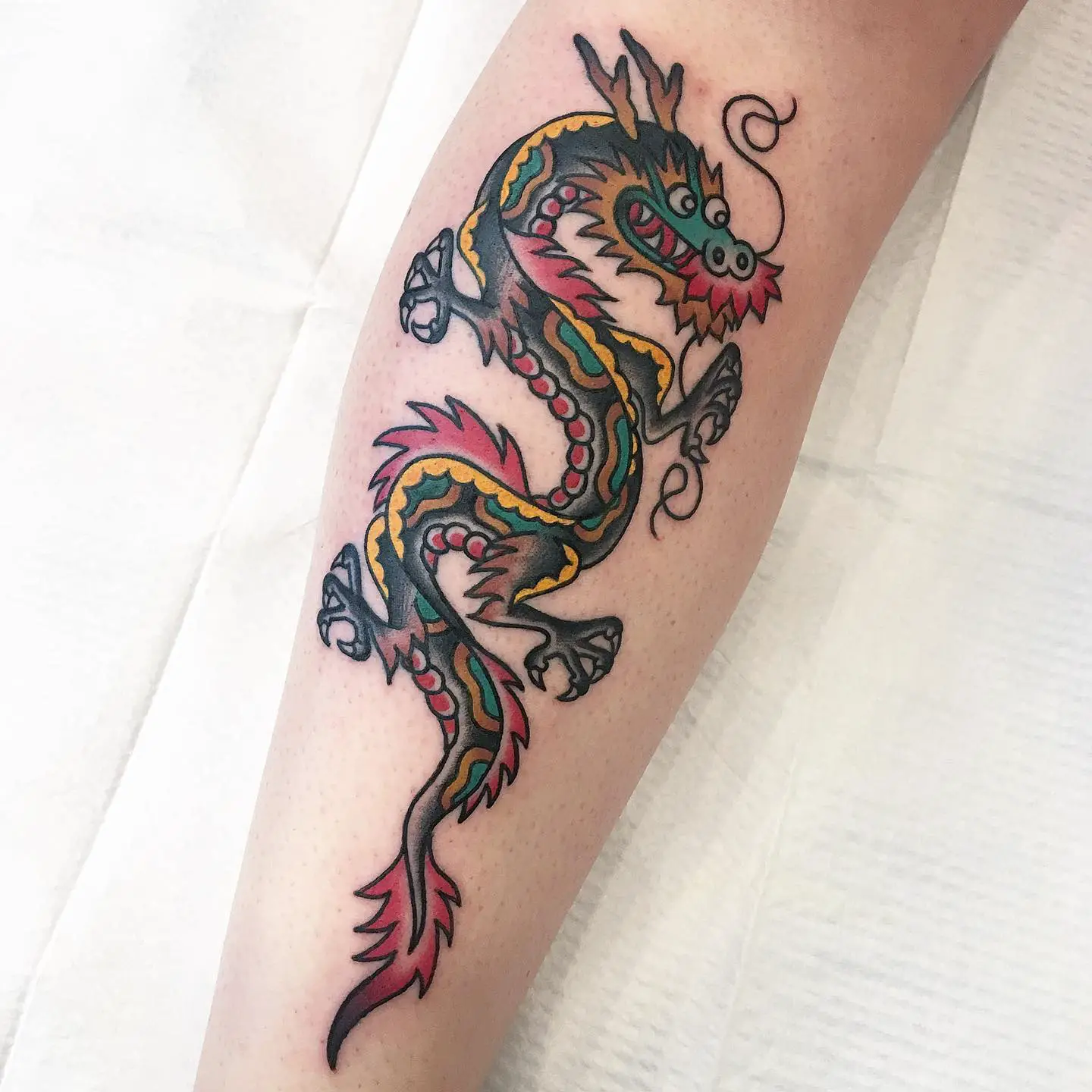 Traditional dragon tattoo by harringtontattoo