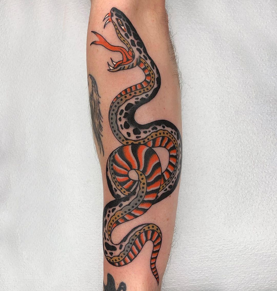 Traditional snake tattoo by summers.tattoos